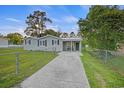 Charming single-story home with a fenced yard, driveway, and covered porch at 109 Plum Ln., Andrews, SC 29510