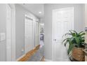 Bright hallway with updated flooring, crisp white doors, and a glimpse of the living space beyond at 1101 Possum Trot Rd. # D201, North Myrtle Beach, SC 29582