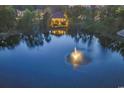 Beautiful view from the water of the back of the home and its expansive waterfront and manicured lawn at 1108 Surf Pointe Dr., North Myrtle Beach, SC 29582