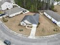 Aerial view of the home showcasing its landscaping, driveway, and surrounding neighborhood at 1222 Midtown Village Dr., Conway, SC 29526
