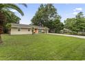 Well-maintained home with lush lawn, mature trees, and inviting curb appeal at 1223 Naylor Ave., Myrtle Beach, SC 29577