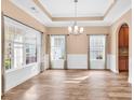 Bright dining area featuring hardwood floors, wainscoting, and natural light at 1410 Bohicket Ct., Myrtle Beach, SC 29579