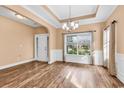 Elegant dining room with hardwood floors, a chandelier, and large window at 1410 Bohicket Ct., Myrtle Beach, SC 29579