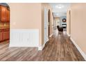 Inviting hallway showcasing beautiful hardwood floors and wainscoting detail at 1410 Bohicket Ct., Myrtle Beach, SC 29579