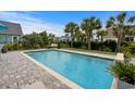 Beautiful backyard pool with a brick patio, surrounded by lush landscaping and plenty of room for entertaining at 1833 Lake Egret Dr., North Myrtle Beach, SC 29582