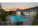 Relaxing pool with a brick patio, perfect for outdoor entertaining and enjoying the serene backyard setting at 1833 Lake Egret Dr., North Myrtle Beach, SC 29582