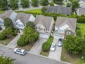 An aerial view shows the home nestled in a neighborhood with manicured lawns and tree-lined streets at 185 Fulbourn Pl., Myrtle Beach, SC 29579