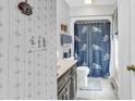 Bathroom with vanity, toilet, and shower-tub combination at 1880 Plantation Dr., Myrtle Beach, SC 29577