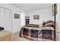 Bedroom with a comfortable bed, natural light, and closet at 1880 Plantation Dr., Myrtle Beach, SC 29577