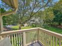 Picturesque view from the balcony overlooking a lush backyard with mature trees and well-maintained greenery at 210 Westleton Dr. # 13-D, Myrtle Beach, SC 29572