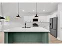 Contemporary kitchen with stainless steel appliances, a central island and stylish pendant lighting at 218 Calhoun Falls Dr., Myrtle Beach, SC 29579