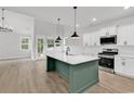 Modern kitchen featuring an island with a sink, stainless steel appliances, and ample counter space at 218 Calhoun Falls Dr., Myrtle Beach, SC 29579