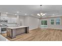 Open-concept living area with recessed lighting and an adjacent kitchen and dining space at 2220 Flatleaf Ct, Longs, SC 29568