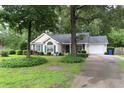 Charming home with a well-maintained lawn and mature trees in a quiet neighborhood at 3001 Dewberry Dr., Conway, SC 29527