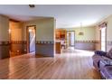 Spacious living room with hardwood floors, opening to the kitchen, perfect for entertaining at 3150 Dusty Rd., Loris, SC 29569