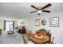 Open-concept living room and dining area with plenty of natural light and a comfortable sofa at 3308 S Ocean Blvd. # 2_B, North Myrtle Beach, SC 29582