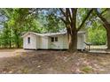 View of the home's rear exterior with a tree in the yard at 3519 Cates Bay Hwy., Conway, SC 29527
