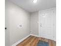 A mud room featuring wood-look floors, a utility sink, and a door at 3519 Cates Bay Hwy., Conway, SC 29527