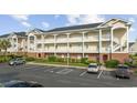 A well-maintained three-story condo with brick base, charming balconies, and accessible parking in a well-landscaped community at 3983 Forsythia Ct. # 301, Myrtle Beach, SC 29588