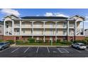 A well-maintained three-story condo with brick base, charming balconies, and accessible parking in a well-landscaped community at 3983 Forsythia Ct. # 301, Myrtle Beach, SC 29588