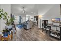Open-concept living area with hardwood floors, modern furniture, and plenty of natural light at 446 Rycola Circle, Surfside Beach, SC 29575