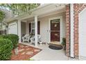 Inviting front porch with wicker chairs and decorative plants enhance the home's curb appeal at 592 Riverward Dr. # 592, Myrtle Beach, SC 29588