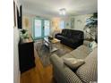 Comfortable living room with stylish furniture, an area rug, and a bright, airy feel at 6001-1623 S Kings Hwy., Myrtle Beach, SC 29575