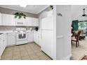 Well-lit kitchen with appliances, tile floors and seamless pass through to living area at 6015 Catalina Dr. # 733, North Myrtle Beach, SC 29582