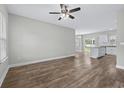 View of an open concept living room with sleek floors and a ceiling fan at 104 Browns Hollow Ct., Loris, SC 29569