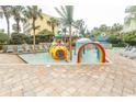 Charming splash area with colorful water features and lounge chairs at 1105 S Ocean Blvd. # 932, Myrtle Beach, SC 29577