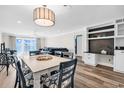 Open-concept living area with views, modern furnishings, and built-in shelving at 1119 S Ocean Blvd. # 8, Surfside Beach, SC 29575