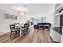 Spacious living and dining area boasting hardwood floors and abundant natural light at 1119 S Ocean Blvd. # 8, Surfside Beach, SC 29575