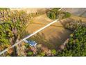 Expansive aerial view of a secluded home surrounded by farm land and mature trees at 1200 Bergen Dr., Loris, SC 29569