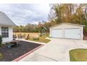 Large backyard with detached garage, playground, and patio furniture perfect for outdoor entertaining at 1200 Bergen Dr., Loris, SC 29569