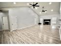 Bright, spacious living room boasting vaulted ceilings, recessed lighting, a fireplace, and durable, attractive floors at 126 Clovis Circle, Myrtle Beach, SC 29579
