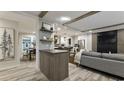 Stylish living room featuring modern decor, wood-look floors, and an open layout at 1325 Rabbit Ln., Conway, SC 29526
