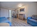 Cozy living room with seating, dining area, and modern amenities at 1501 Ocean Blvd. S # 242, Myrtle Beach, SC 29577