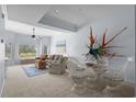 Cozy living room features neutral tones, stylish decor, comfortable seating, and a view of the outdoors at 1551 Spinnaker Dr. # 5312, North Myrtle Beach, SC 29582