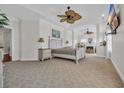 Spacious main bedroom with sitting area, tray ceilings, and large windows for ample natural light at 1619 Eastover Ln., North Myrtle Beach, SC 29582