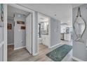 Hallway view with access to the bathroom and living area with an open-concept layout at 1625 S Ocean Blvd. # 211, North Myrtle Beach, SC 29582
