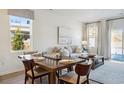 Cozy living space features a dining table, neutral décor, and sliding glass doors to the outside at 1780 Hunting Harris Ct # 19, Ocean Isle Beach, NC 28469