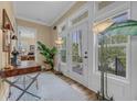 Elegant entryway with a view to an outside balcony, complemented by stylish furnishings and natural light at 191 Grackle Ln., Pawleys Island, SC 29585