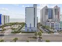 Exterior elevated view of a condominium featuring an outdoor pool and proximity to the beach at 2001 S Ocean Blvd. # 815, Myrtle Beach, SC 29577