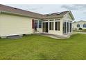 Cozy sunroom addition with lots of windows and light with sliding glass doors for convenient access to the backyard at 216 Walden Lake Rd., Conway, SC 29526