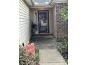 Cozy front porch featuring a classic door, brick accents, and a welcoming entrance at 2707 Canvasback Trail, Myrtle Beach, SC 29588