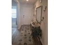 Inviting entryway featuring a decorative rug, console table with mirror, and stylish wall decor at 297 Harvest Ridge Way, Conway, SC 29527