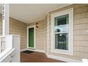 Charming entryway with green door, window and neutral siding at 3833 Myrtle Pointe Dr. # 18 Bu 3, Myrtle Beach, SC 29577