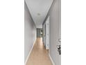 Neutral-toned hallway featuring tile flooring and leading to a brightly lit room with natural light at 4101 Pinehurst Circle # Aa-3, Little River, SC 29566