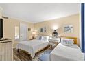 Bright bedroom showcasing two beds, decor, and natural light at 415 Ocean Creek Dr. # 2372, Myrtle Beach, SC 29572