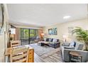Comfortable living room featuring stylish furnishings and a sliding door to the outdoor area at 415 Ocean Creek Dr. # 2372, Myrtle Beach, SC 29572